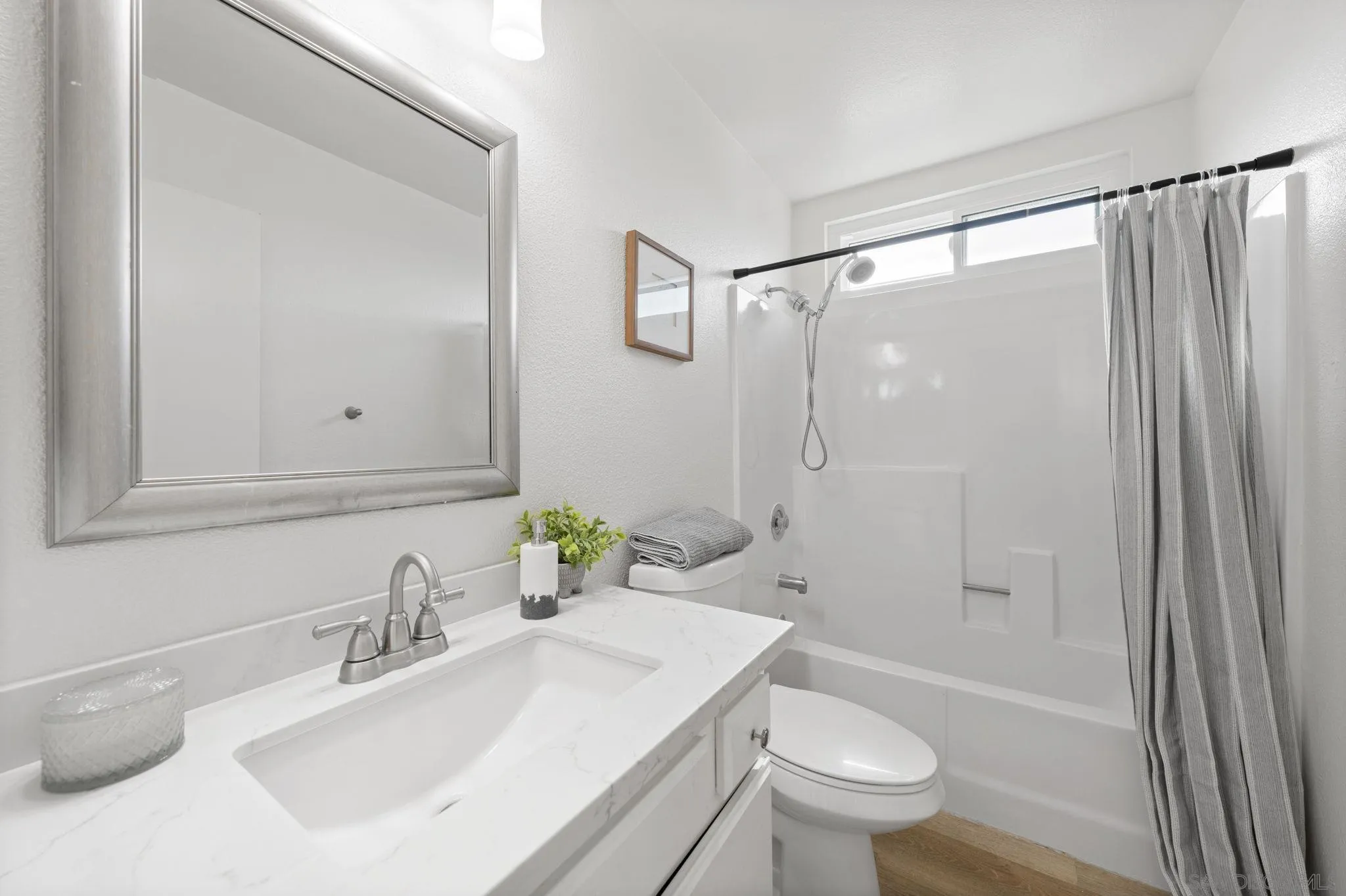 3002 Blue Oak Court Spring Valley, CA 91978 - Photo 12 of 23 a bathroom with a sink toilet and shower