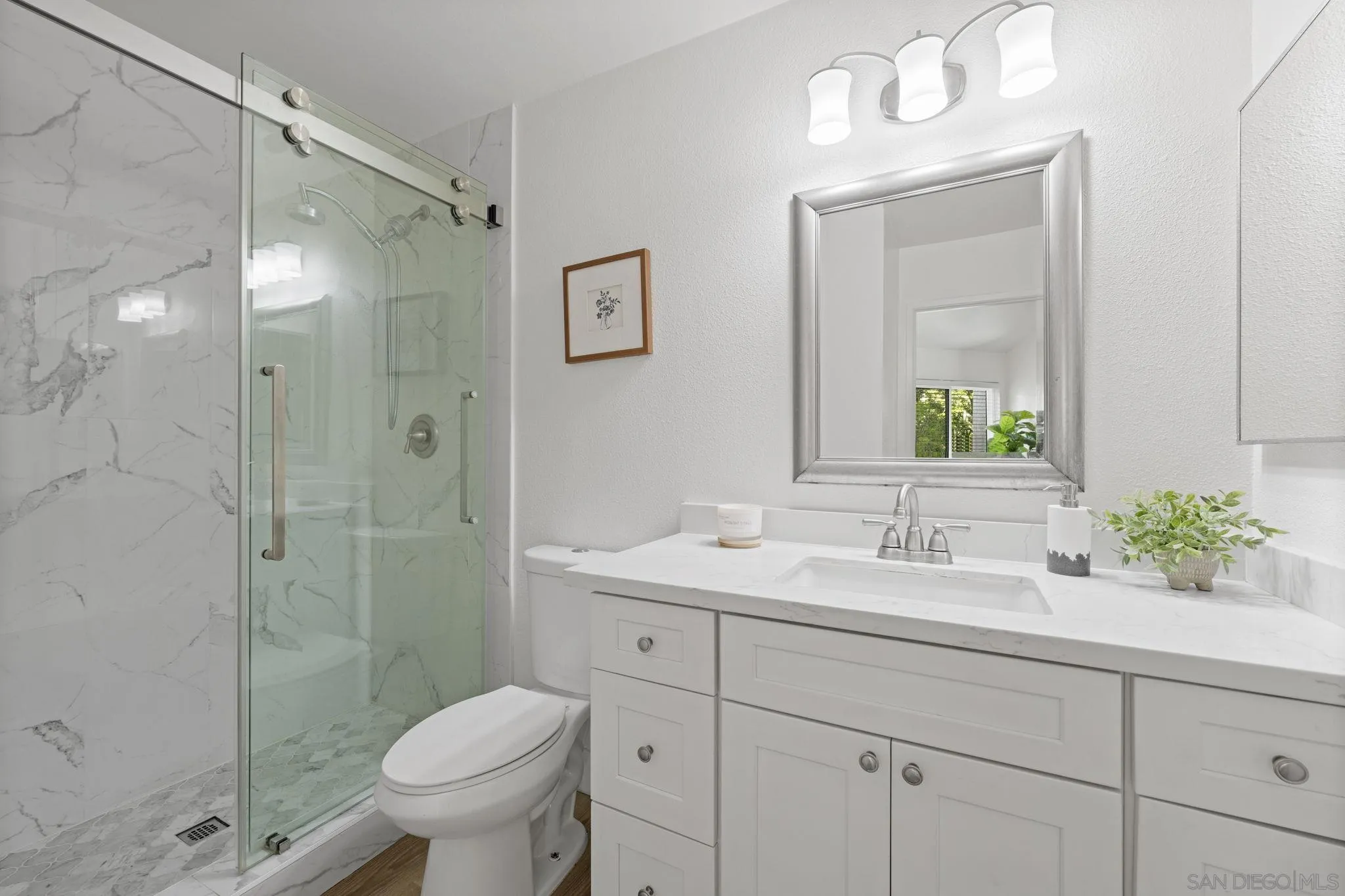3002 Blue Oak Court Spring Valley, CA 91978 - Photo 17 of 23 a bathroom with a sink toilet and shower