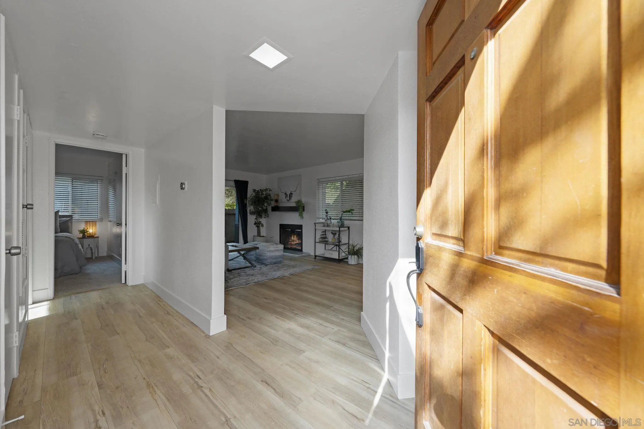 3002 Blue Oak Court Spring Valley, CA 91978 - Photo 2 of 23 a view of a hallway view with wooden floor and furniture