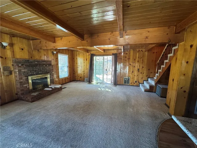 a view of a patio with table and chairs