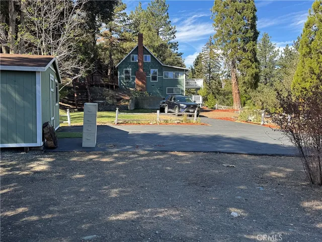 a view of a backyard with trees