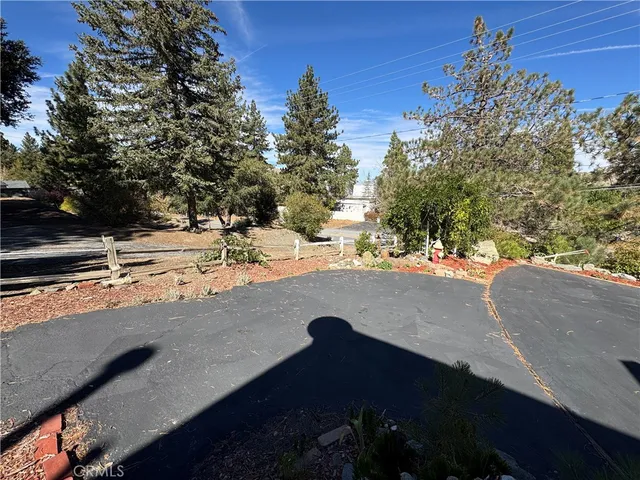 a view of a dry yard with wooden floor