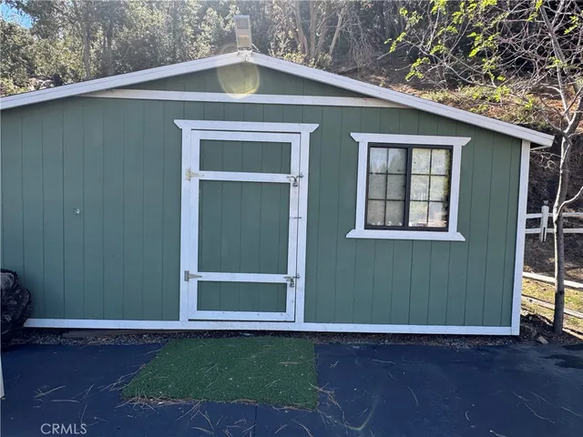 a view of a hall with wooden floor