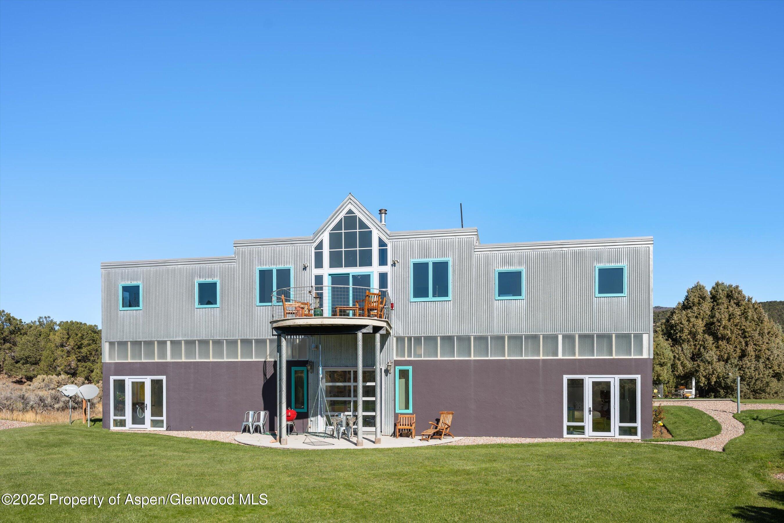 525 Cactus Flats Road Carbondale, CO 81623 - Photo 1 of 50 a front view of a house with garden