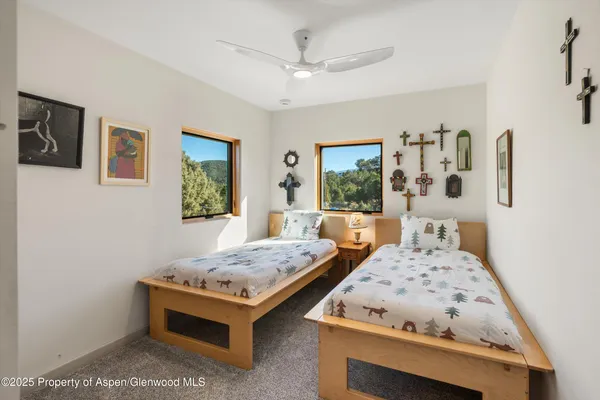 a bedroom with bed and window
