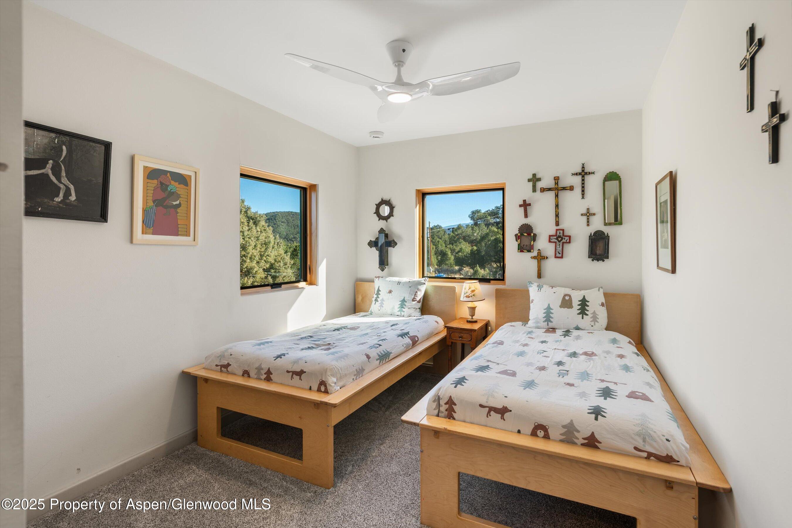 525 Cactus Flats Road Carbondale, CO 81623 - Photo 20 of 50 a bedroom with bed and window