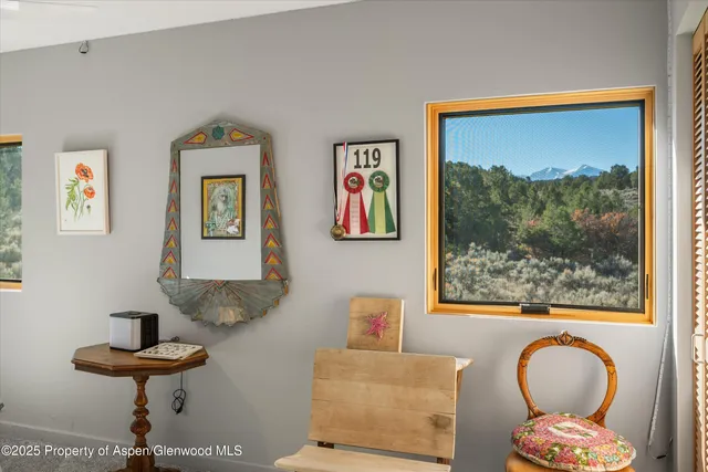 a living room with furniture and a painting