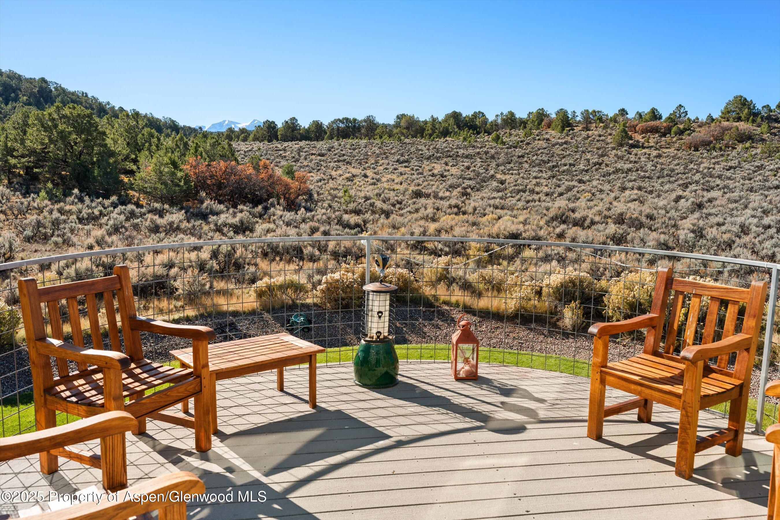 525 Cactus Flats Road Carbondale, CO 81623 - Photo 35 of 50 a view of a terrace with furniture and city view