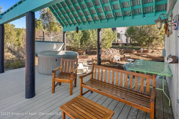 a view of a chairs on wooden deck
