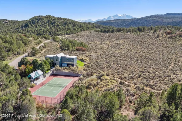 an aerial view of a house with a garden