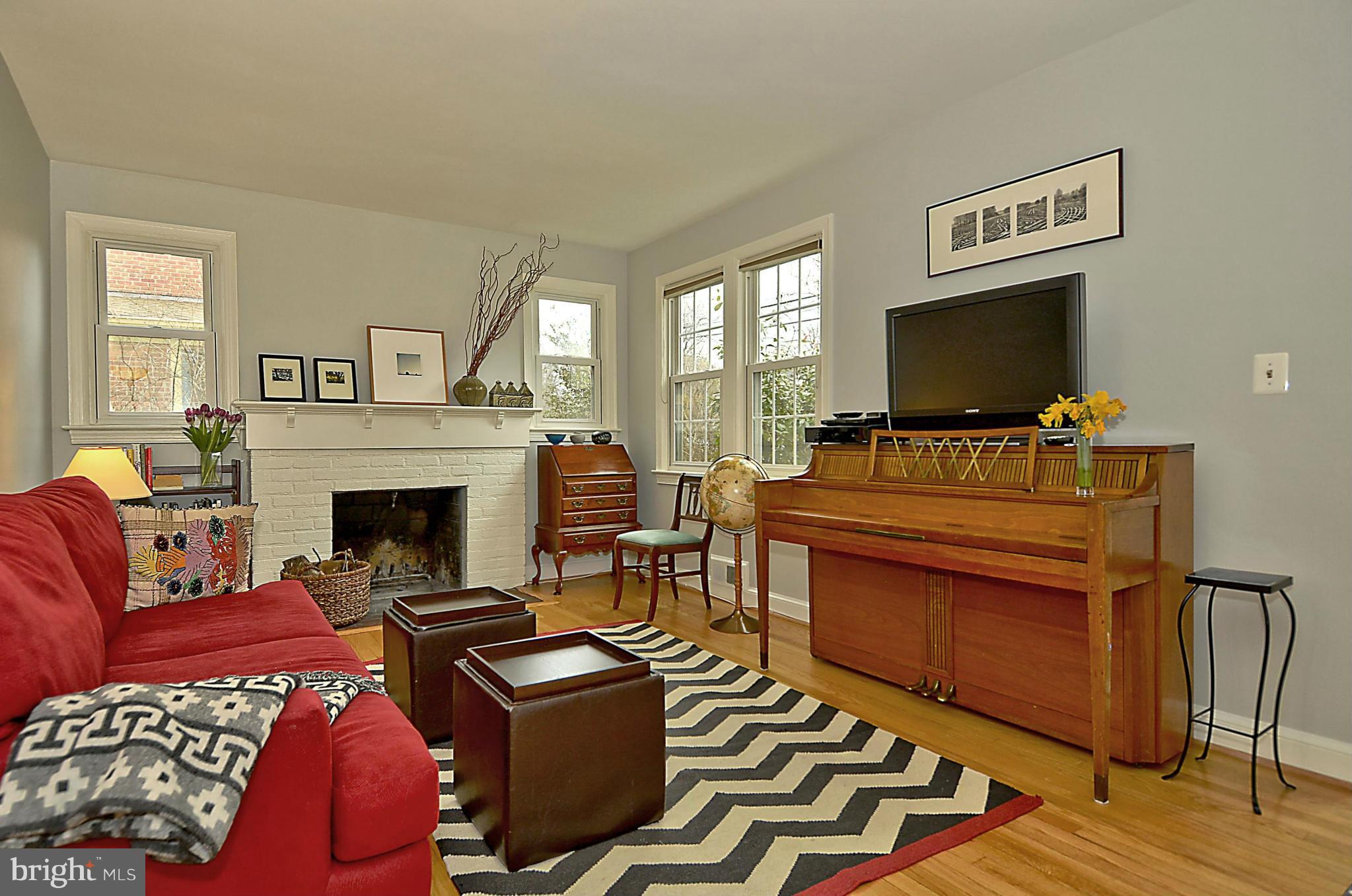 9508 Evergreen Street Silver Spring, MD 20901 - Photo 7 of 30 Living room features beautiful hardwood floors.
