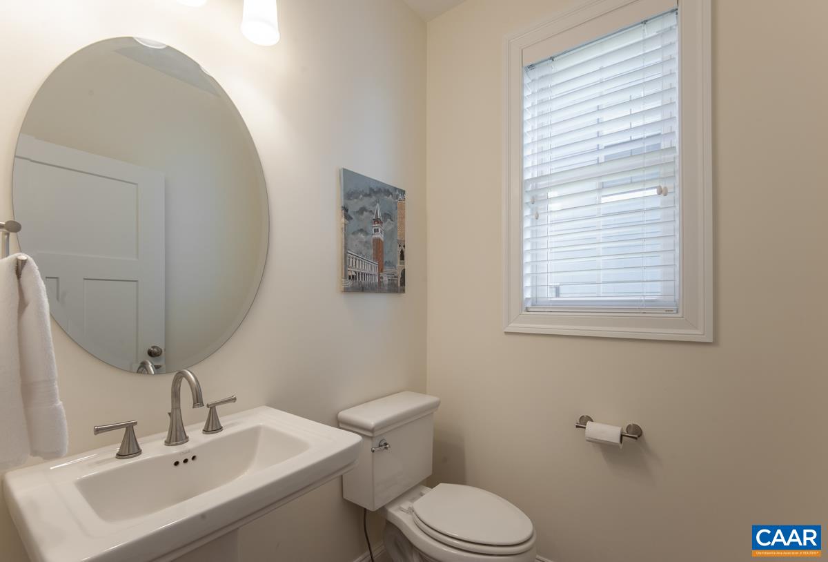 418 Claibourne Road Crozet, VA 22932 - Photo 16 of 45 a bathroom with a sink mirror and toilet