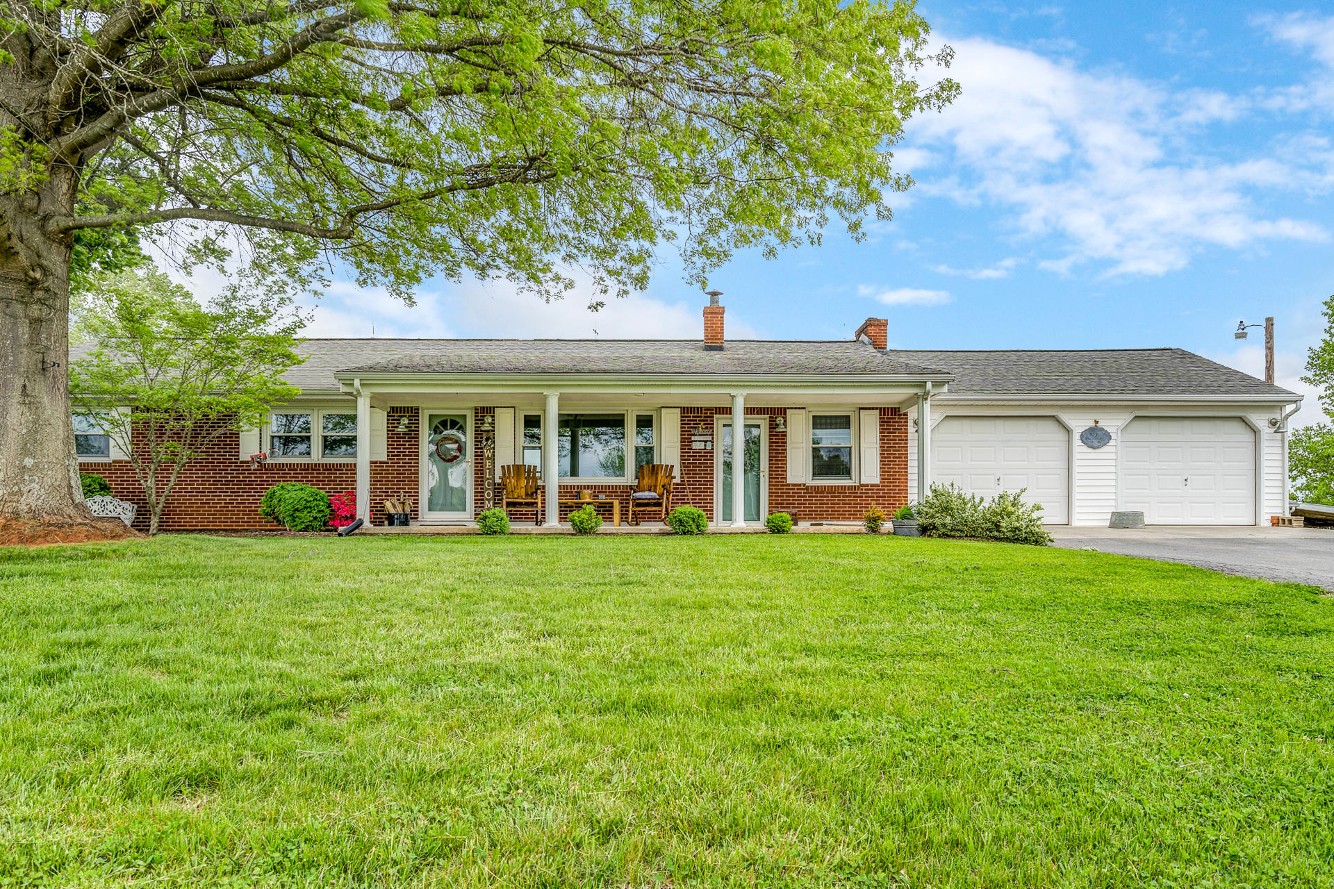1672 Blankenship Road Goodview, VA 24095 - Photo 2 of 39 front view of a house with a garden