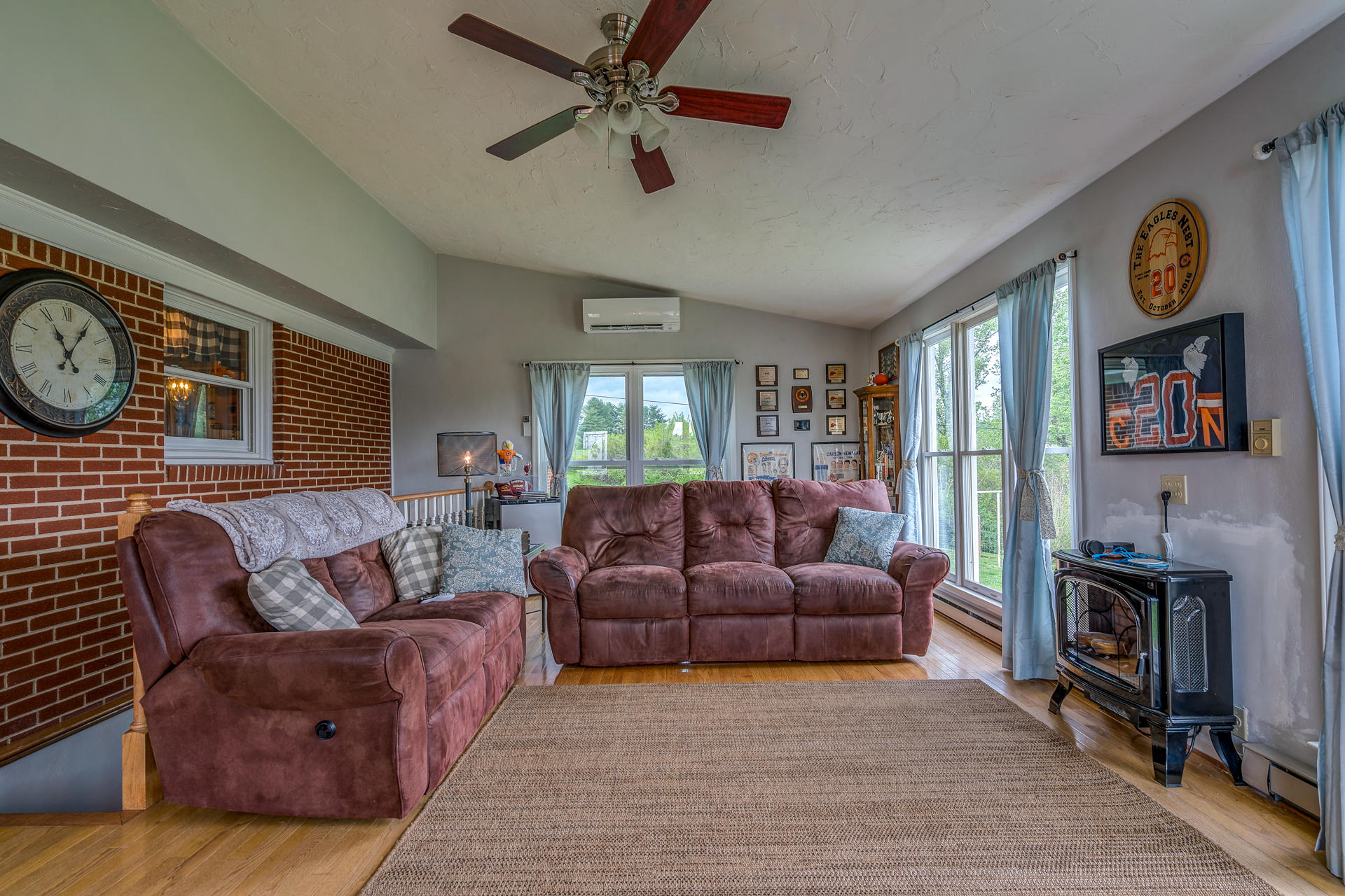 1672 Blankenship Road Goodview, VA 24095 - Photo 15 of 39 a living room with furniture a clock on wall and a window