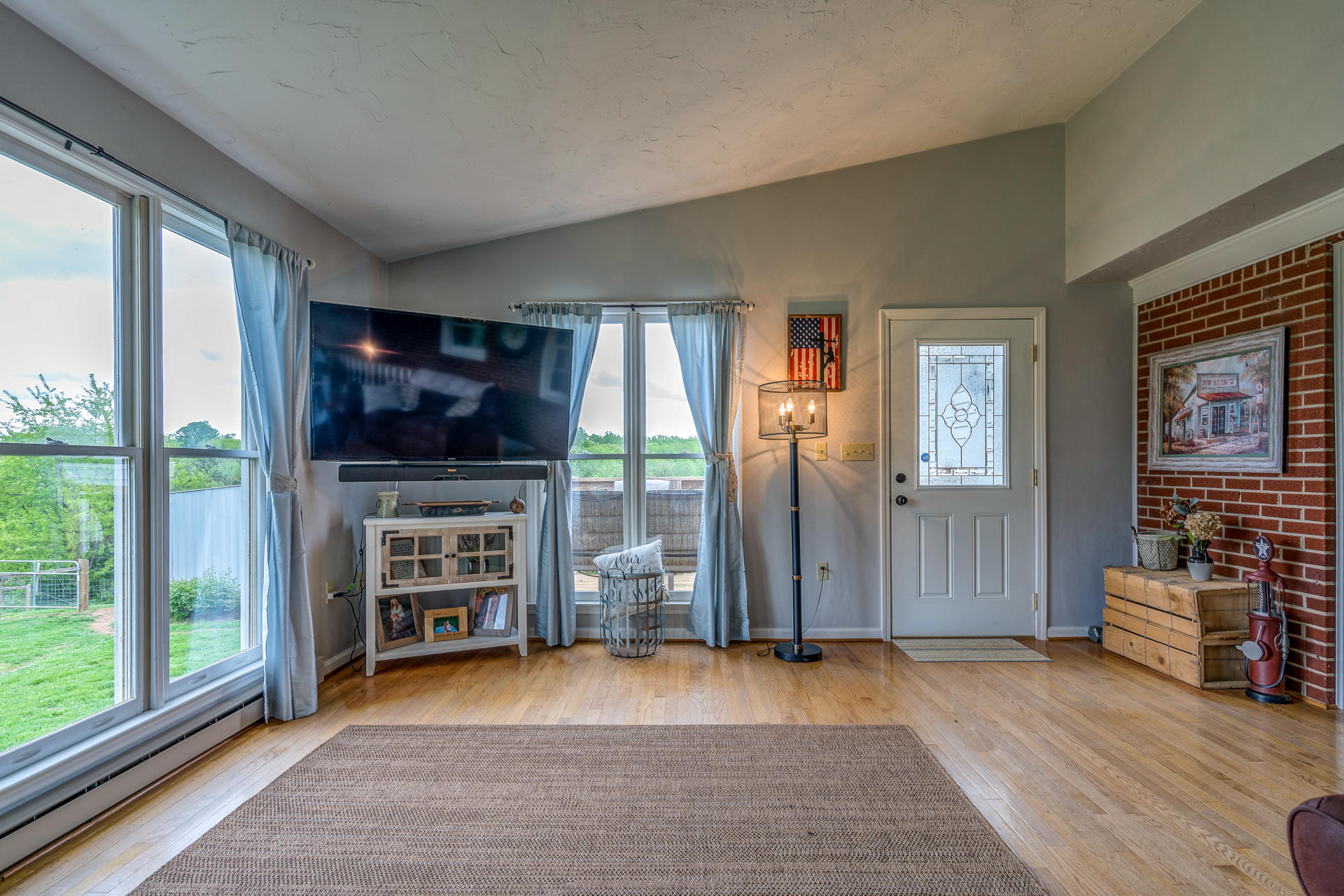 1672 Blankenship Road Goodview, VA 24095 - Photo 17 of 39 a view of empty room with wooden floor and fireplace