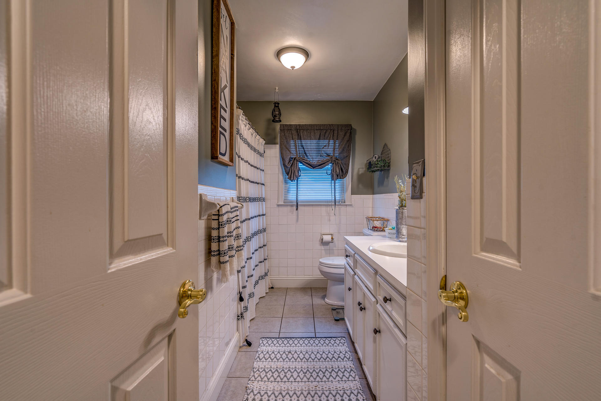 1672 Blankenship Road Goodview, VA 24095 - Photo 18 of 39 a bathroom with double vanity and a bathtub