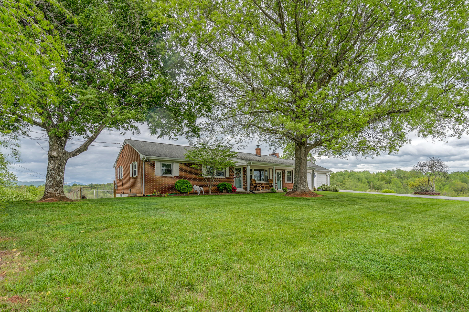 1672 Blankenship Road Goodview, VA 24095 - Photo 36 of 39 a front view of a house with a garden