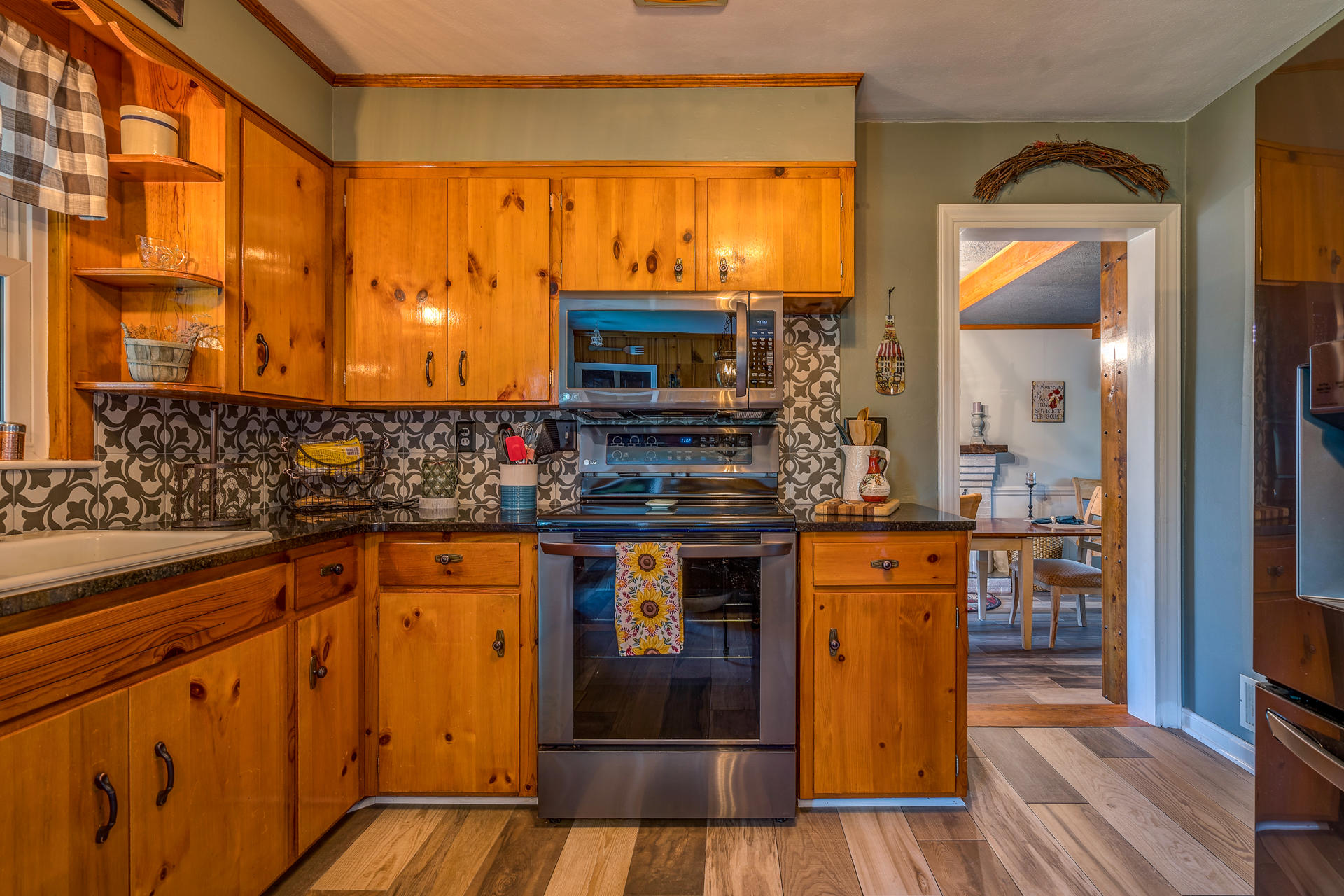 1672 Blankenship Road Goodview, VA 24095 - Photo 10 of 39 a kitchen with stainless steel appliances granite countertop a stove and a sink
