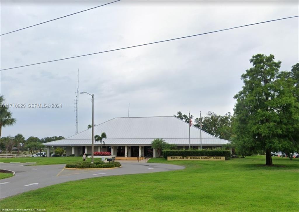8136 Veronese Street Sebring, FL 33872 - Photo 18 of 27 a front view of a building with garden
