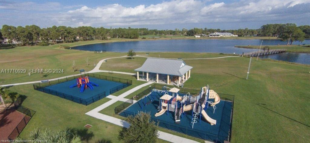 8136 Veronese Street Sebring, FL 33872 - Photo 22 of 27 a view of a lake with couches chairs and city view