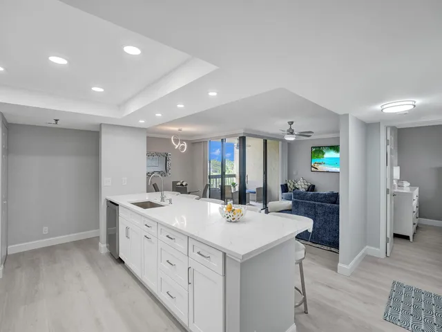 a view of a kitchen counter space and sink