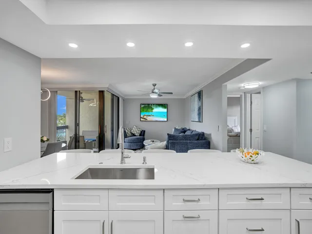a bathroom with double vanity sinks and a mirror