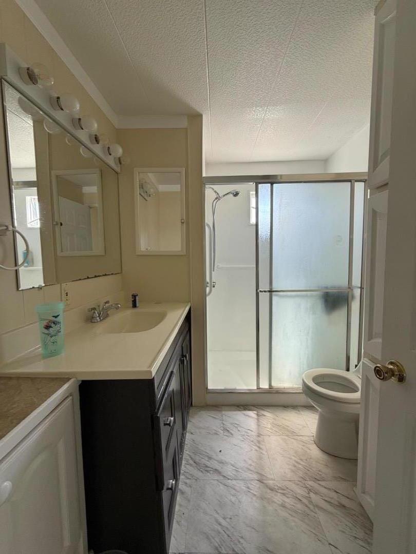 12350-147 Christensen Road, Unit 147 Salinas, CA 93907 - Photo 5 of 15 a bathroom with a sink toilet and shower
