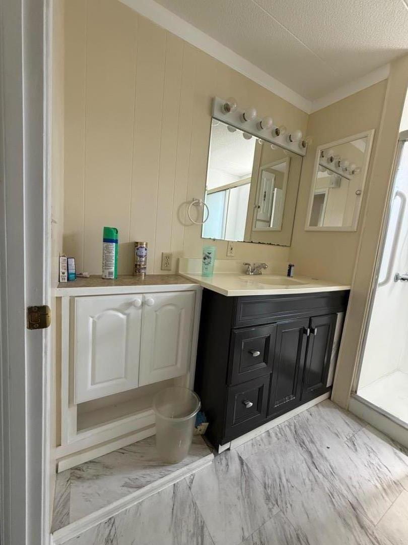 12350-147 Christensen Road, Unit 147 Salinas, CA 93907 - Photo 6 of 15 a bathroom with a sink vanity and mirror