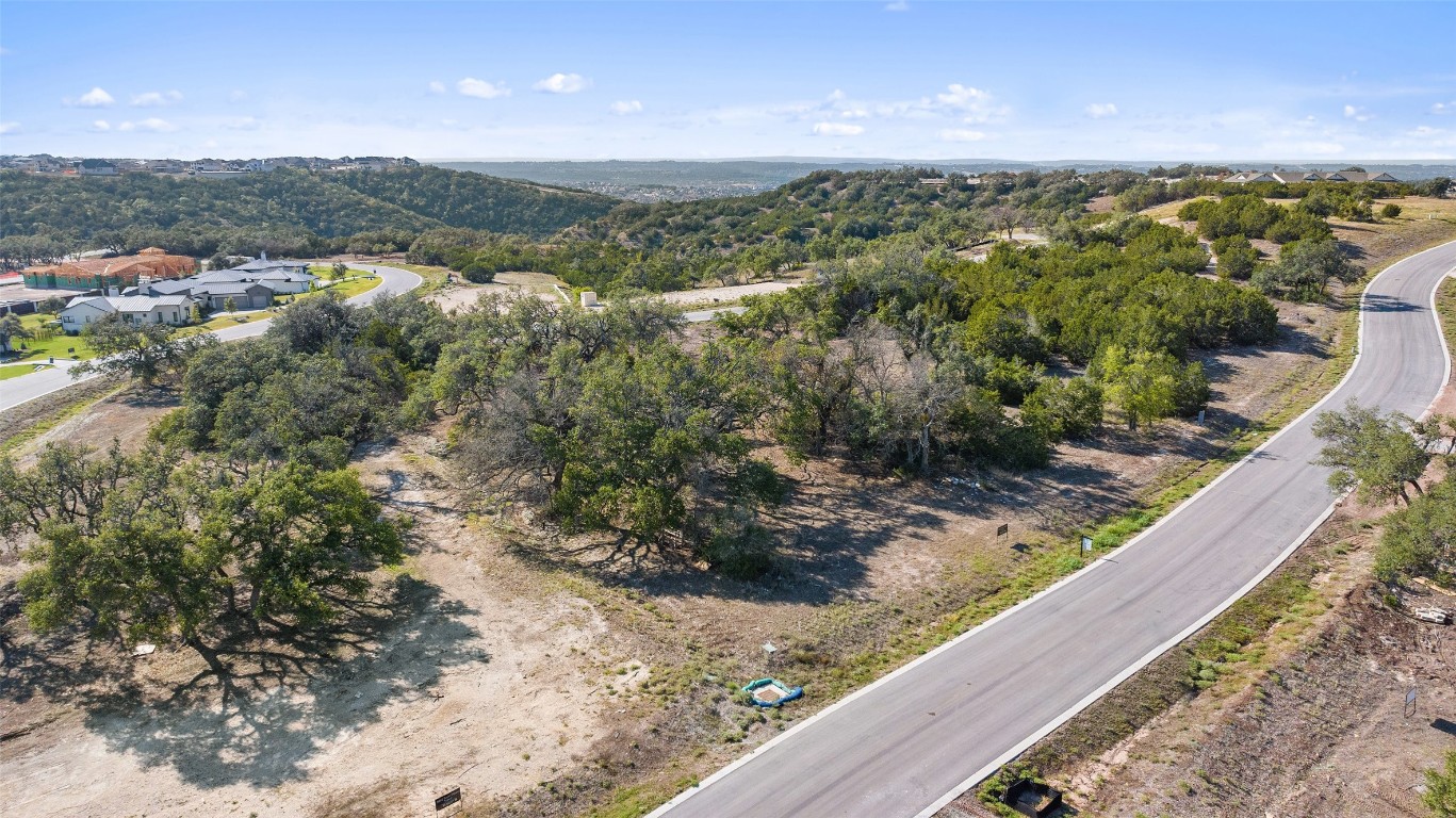 5808 Twin Peaks Trace Austin, TX 78738 - Photo 4 of 7 a view of a yard with wooden fence