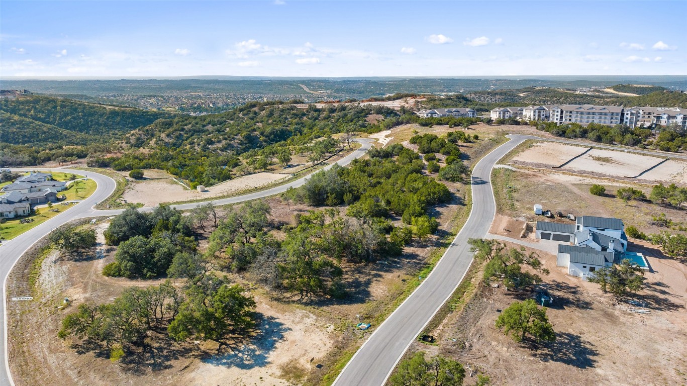 5808 Twin Peaks Trace Austin, TX 78738 - Photo 5 of 7 an aerial view of residential houses with outdoor space