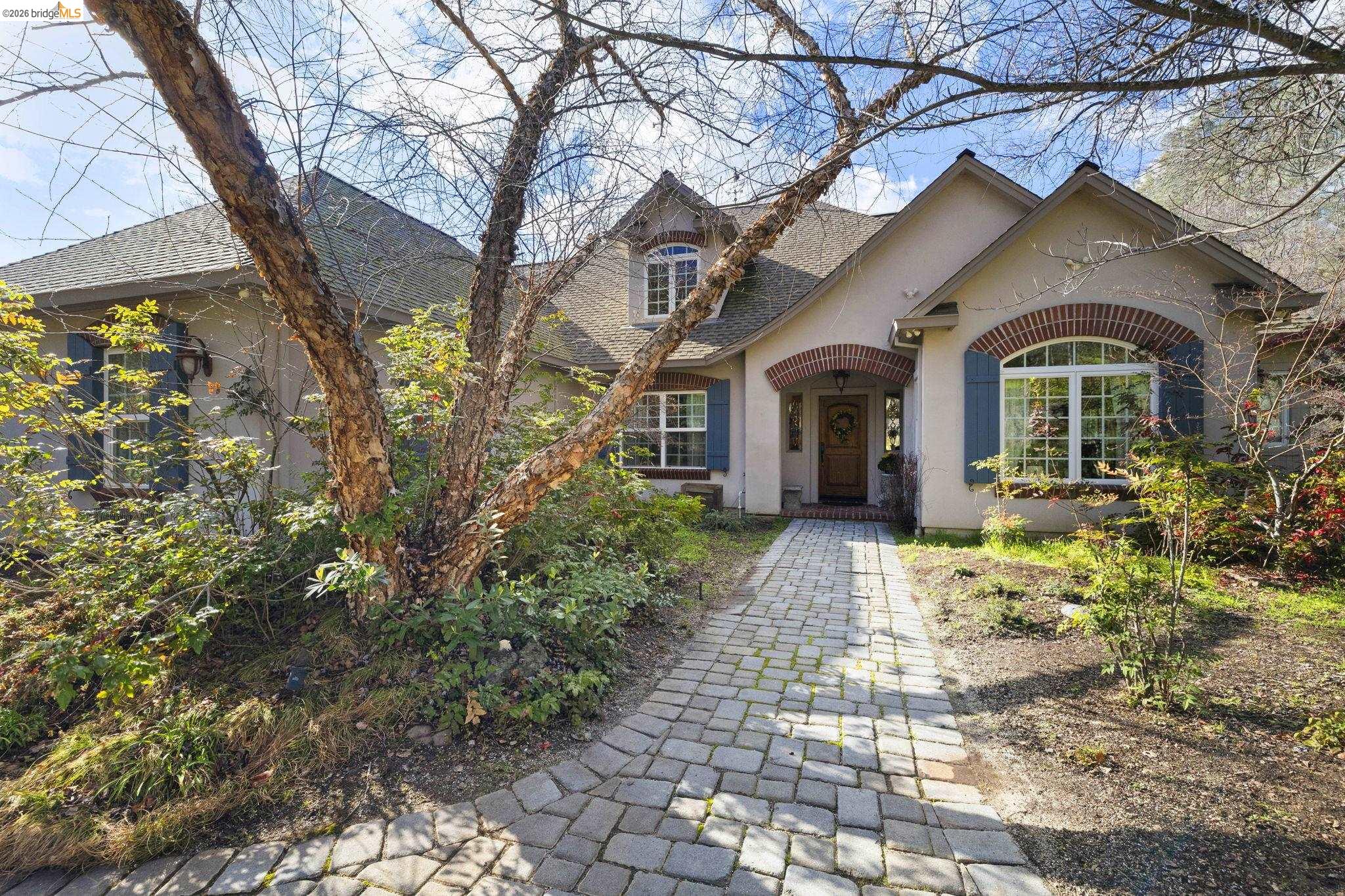 a front view of a house with garden
