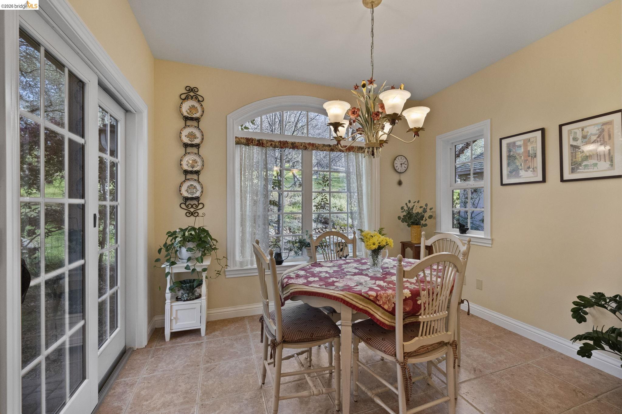 18558 Olov Road Sonora, CA 95370 - Photo 20 of 45 a view of a dining room with furniture and a chandelier