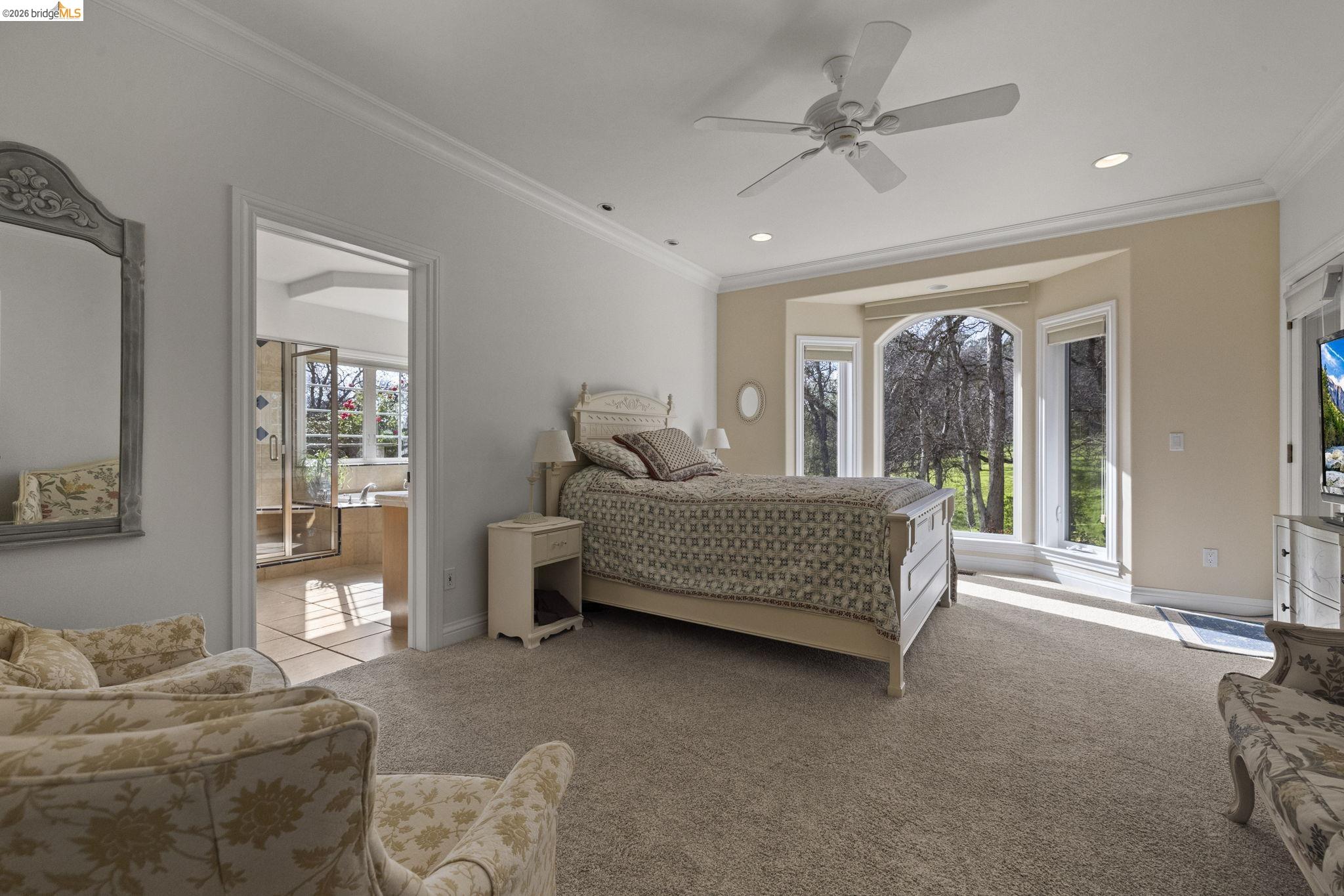 18558 Olov Road Sonora, CA 95370 - Photo 24 of 45 a bedroom with a bed and wooden floor