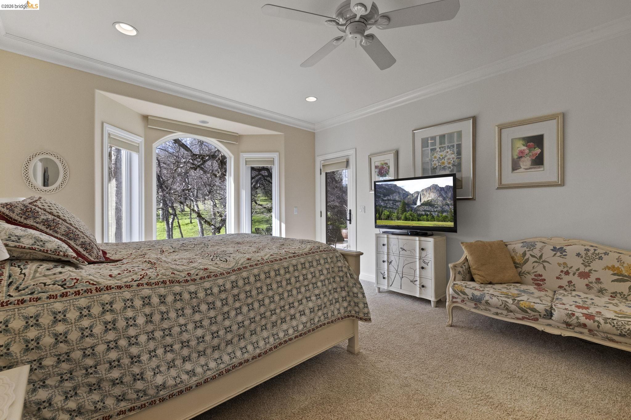 18558 Olov Road Sonora, CA 95370 - Photo 25 of 45 a bedroom with a bed and a couch