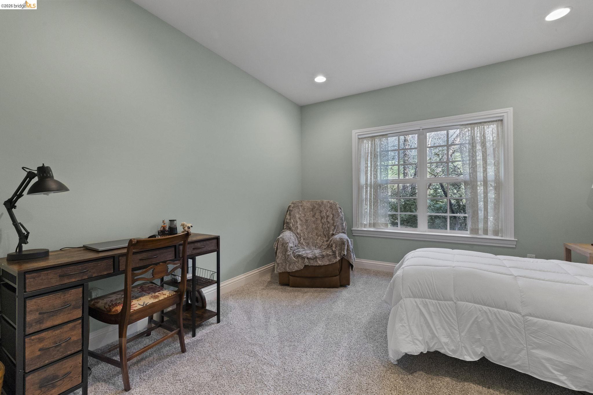 18558 Olov Road Sonora, CA 95370 - Photo 30 of 45 a bedroom with a bed and a window