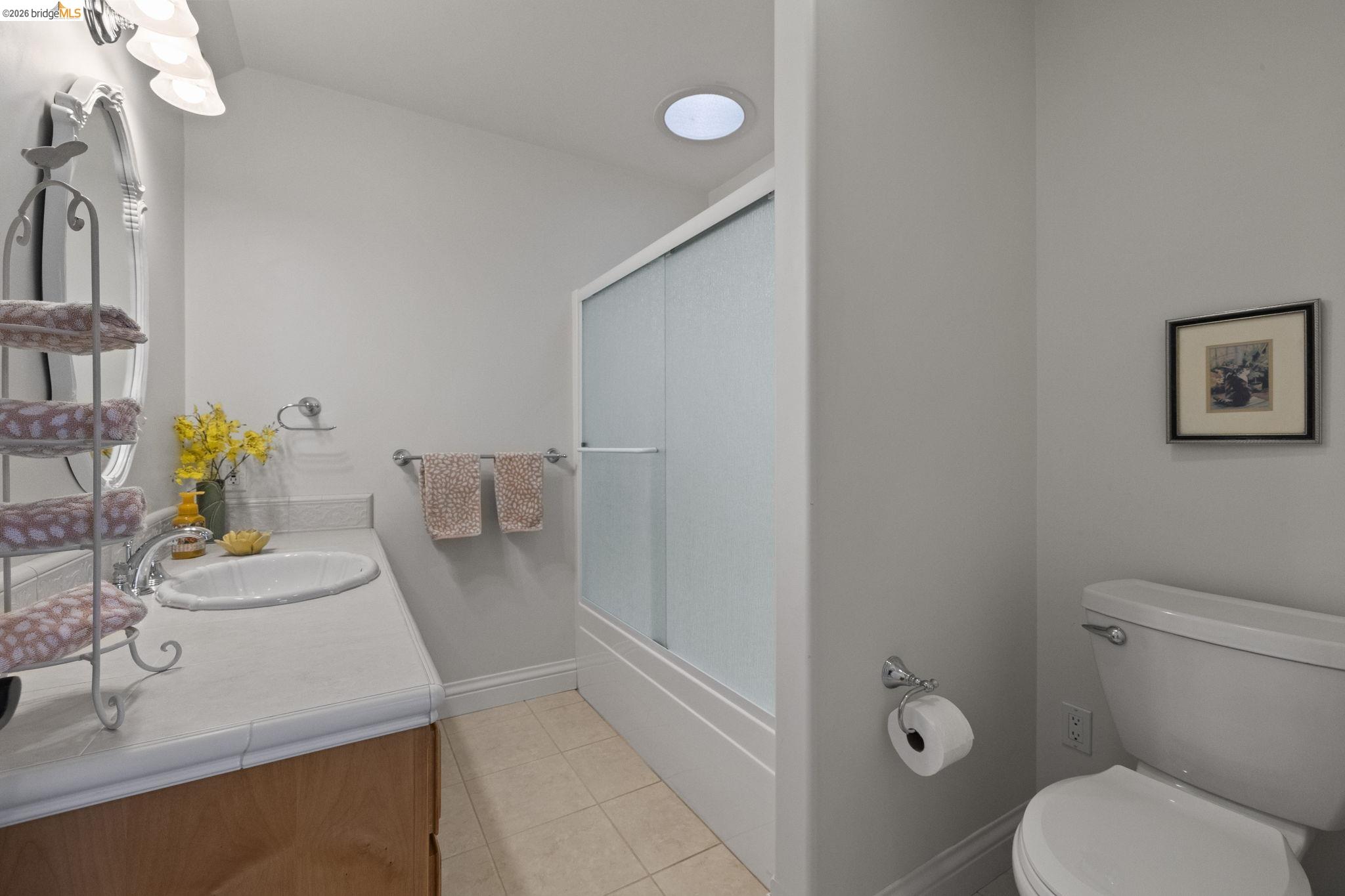 18558 Olov Road Sonora, CA 95370 - Photo 32 of 45 a bathroom with a sink toilet and mirror