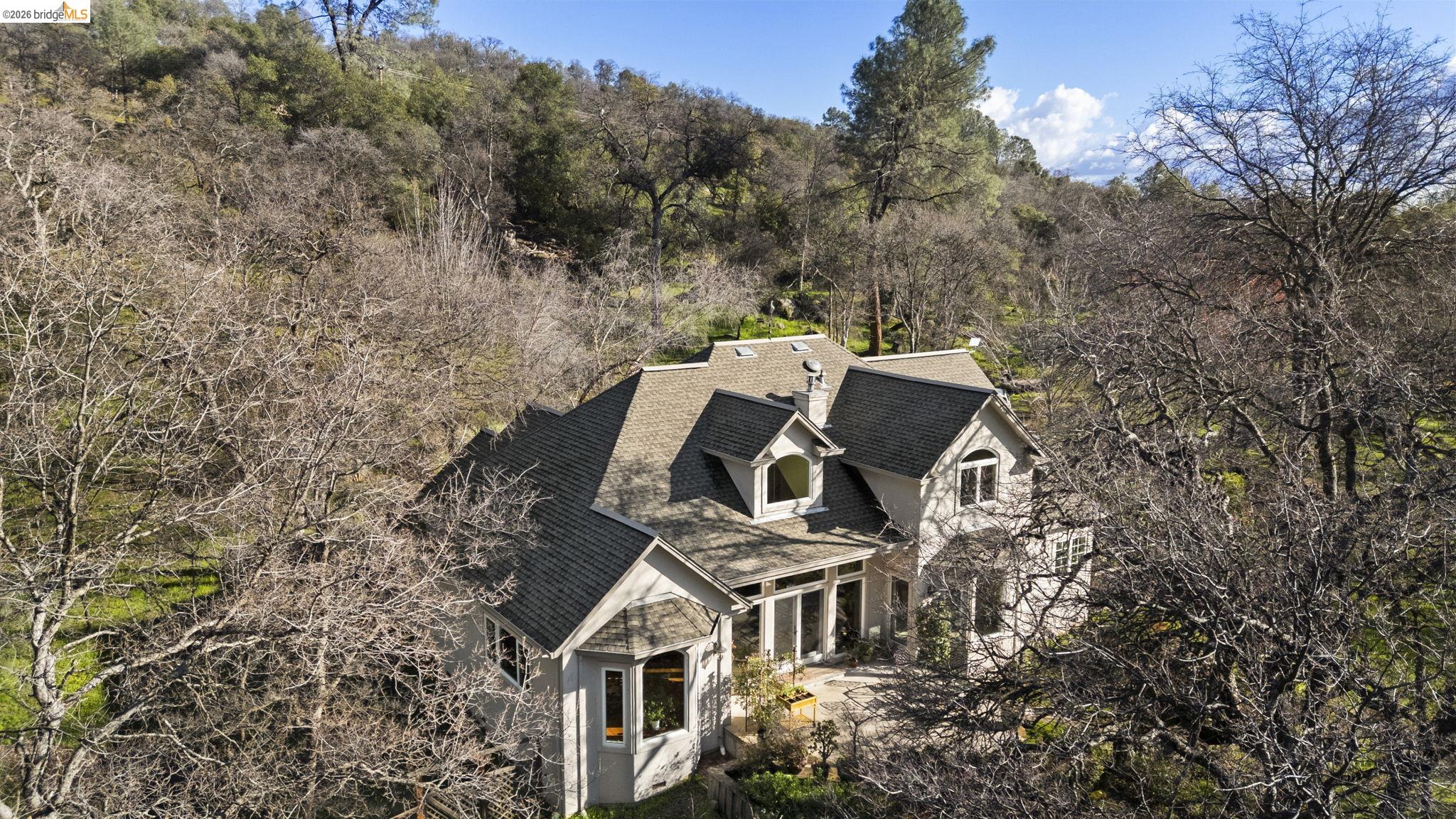 18558 Olov Road Sonora, CA 95370 - Photo 38 of 45 a view of a house with a yard