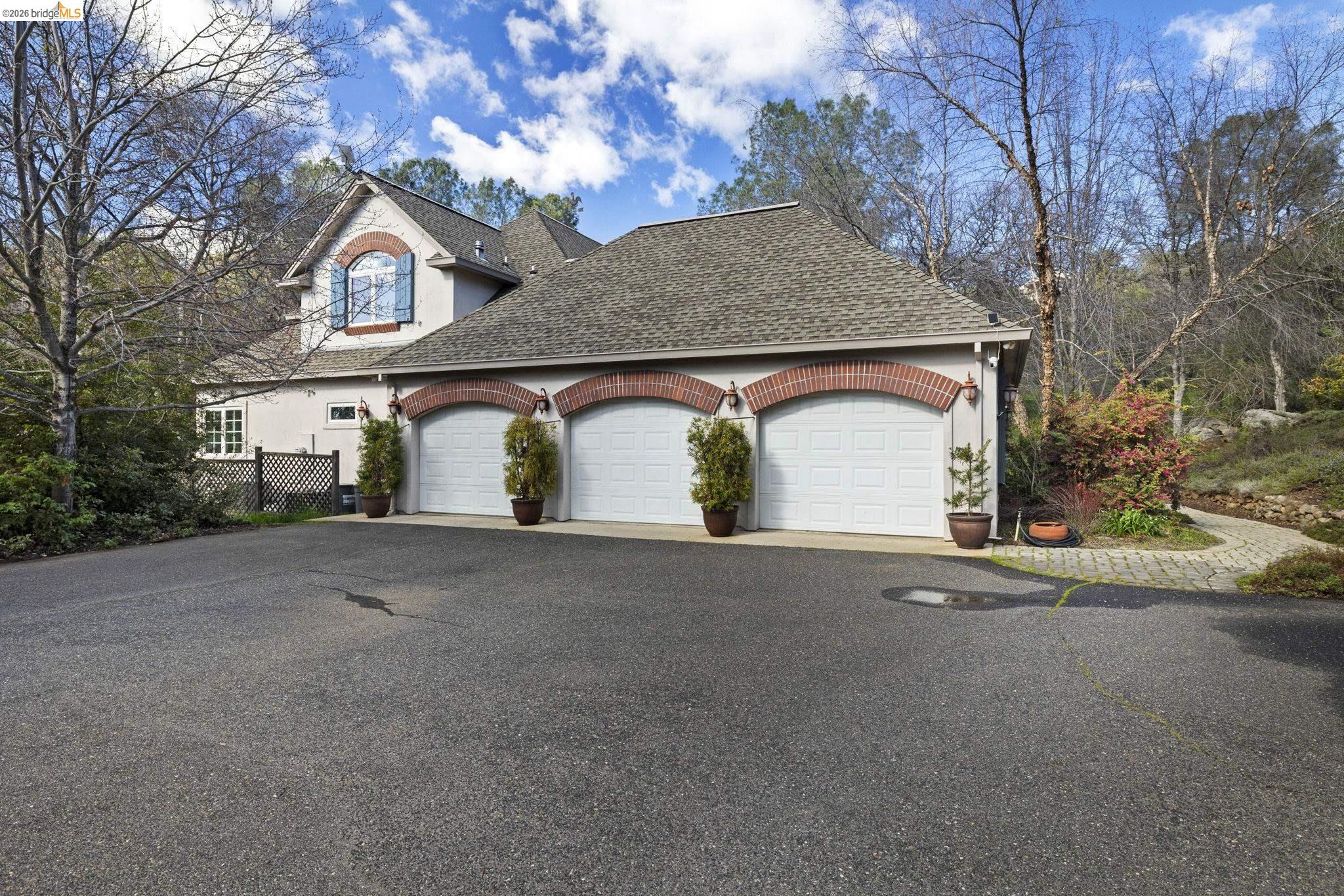 18558 Olov Road Sonora, CA 95370 - Photo 39 of 45 a view of a house with a yard and garage