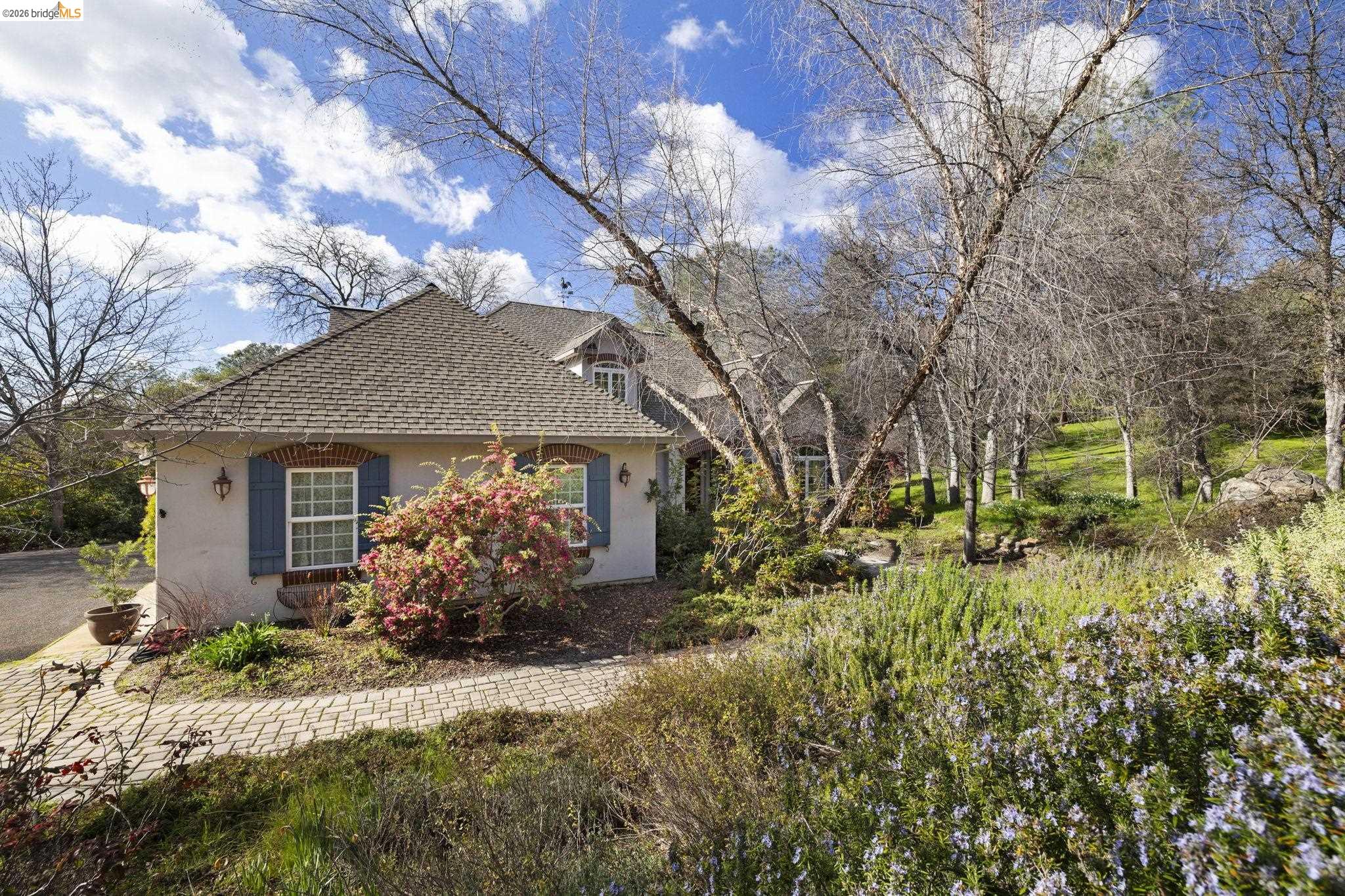 18558 Olov Road Sonora, CA 95370 - Photo 43 of 45 a front view of a house with a yard and garage