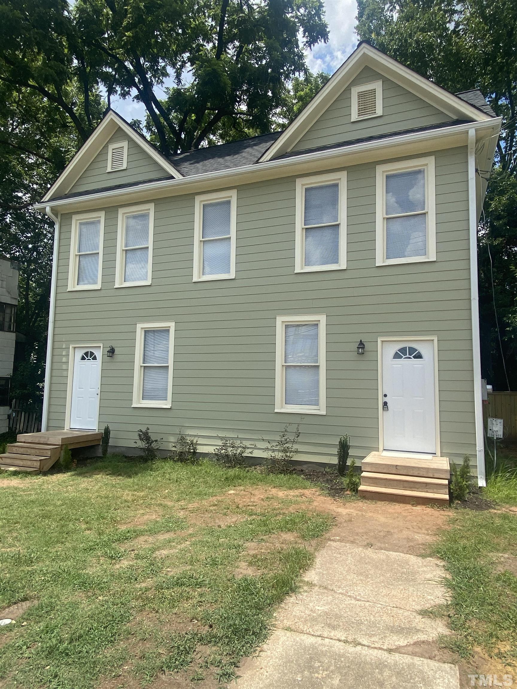 16 Turner Street Raleigh, NC 27607 - Photo 1 of 8 a front view of a house with a yard