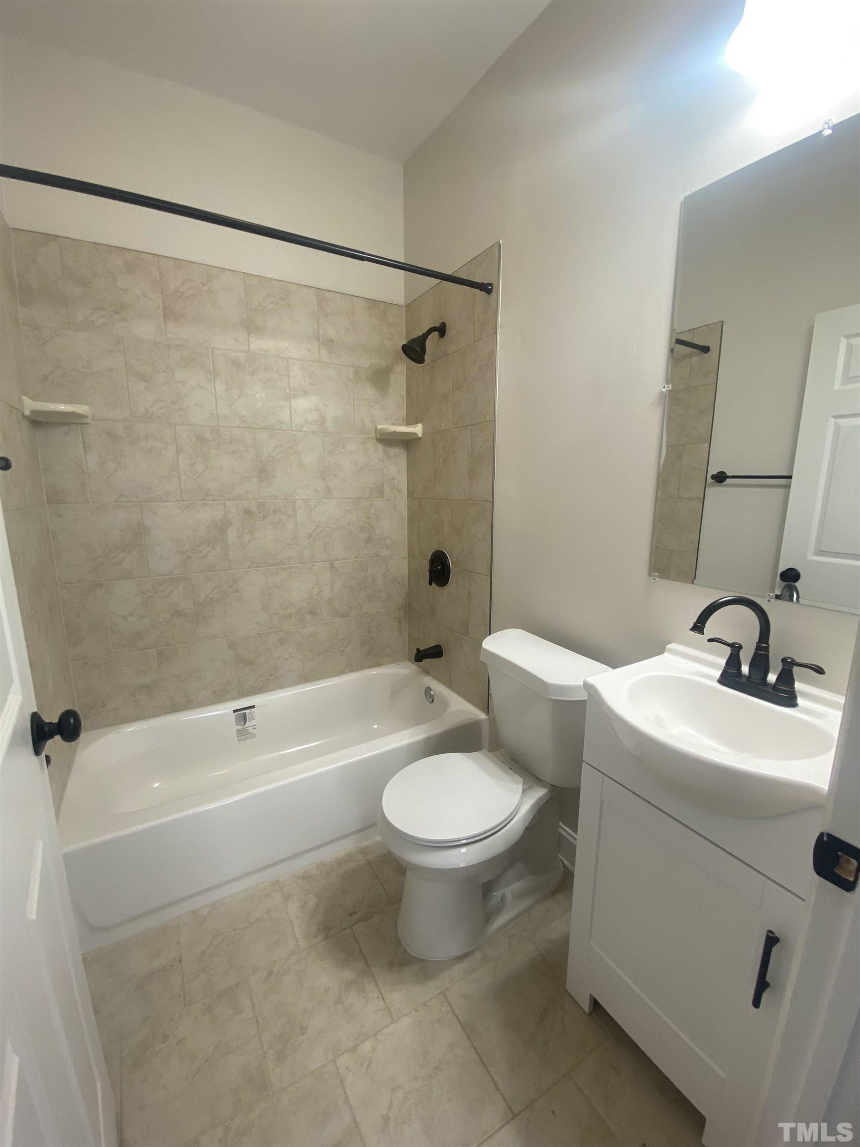 16 Turner Street Raleigh, NC 27607 - Photo 4 of 8 a bathroom with a sink toilet and shower