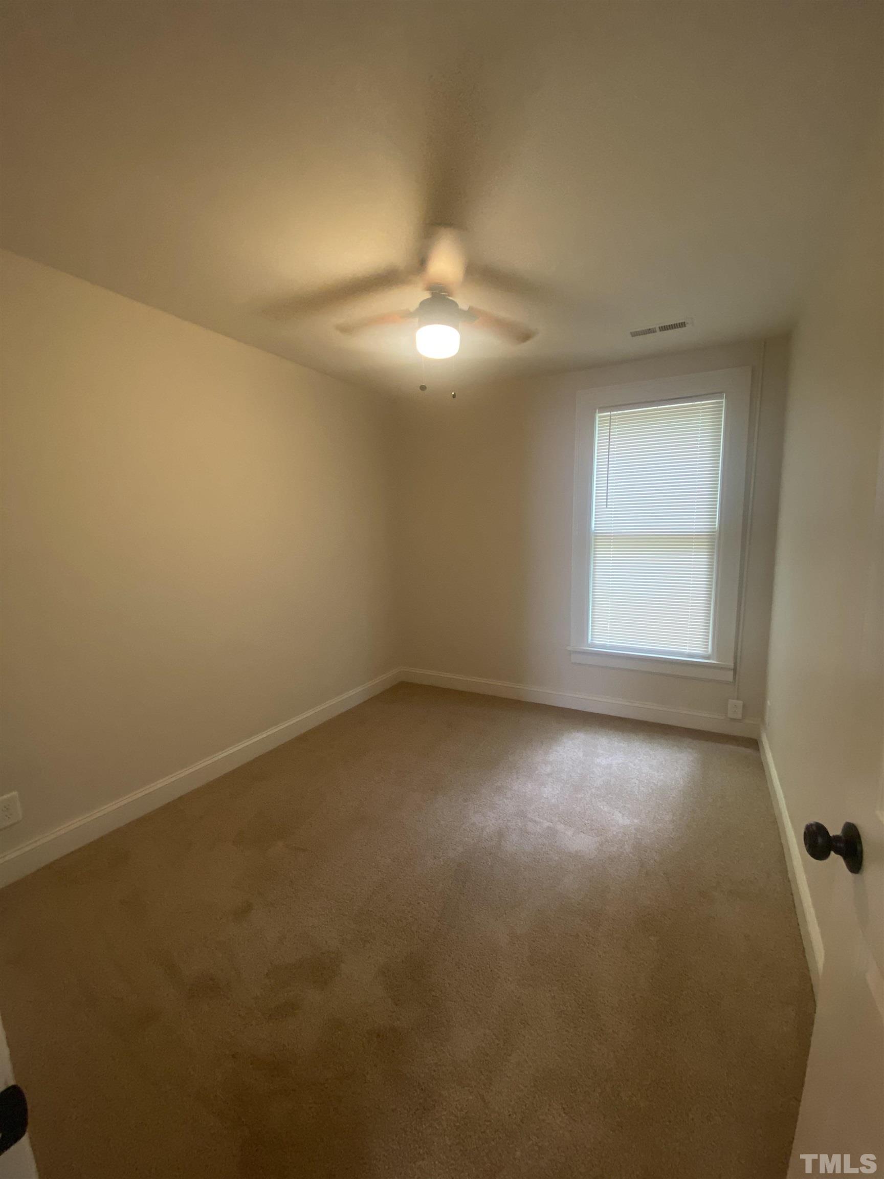 16 Turner Street Raleigh, NC 27607 - Photo 5 of 8 an empty room with a empty space and a window