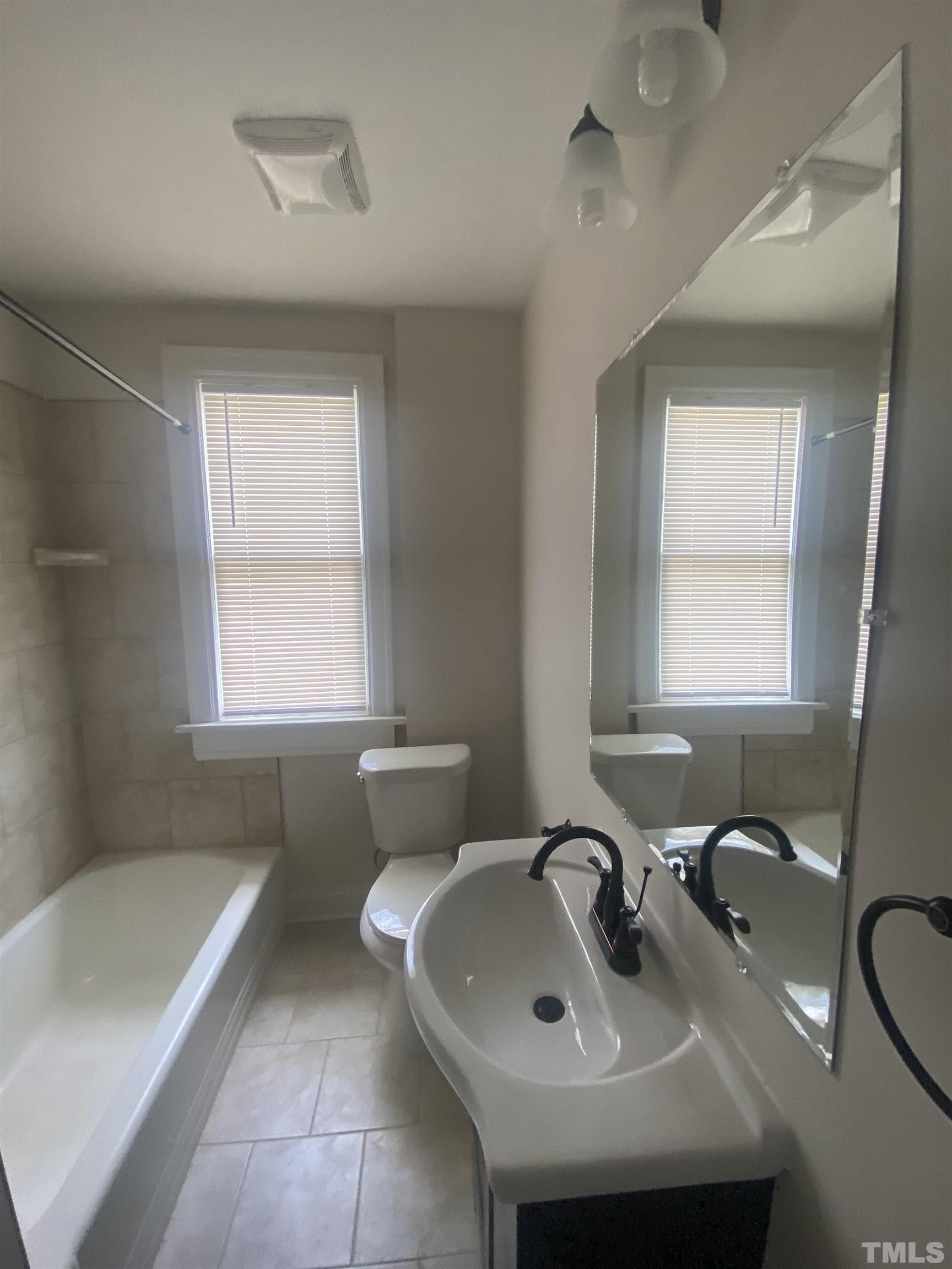 16 Turner Street Raleigh, NC 27607 - Photo 8 of 8 a bathroom with a sink and a bathtub