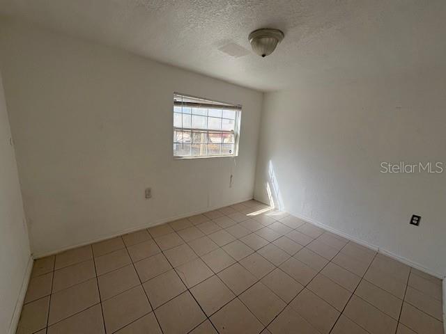 1672 10th Street Sarasota, FL 34236 - Photo 9 of 24 a view of an empty room and window