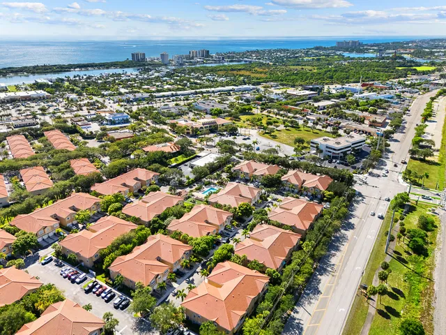 an aerial view of residential houses with outdoor space