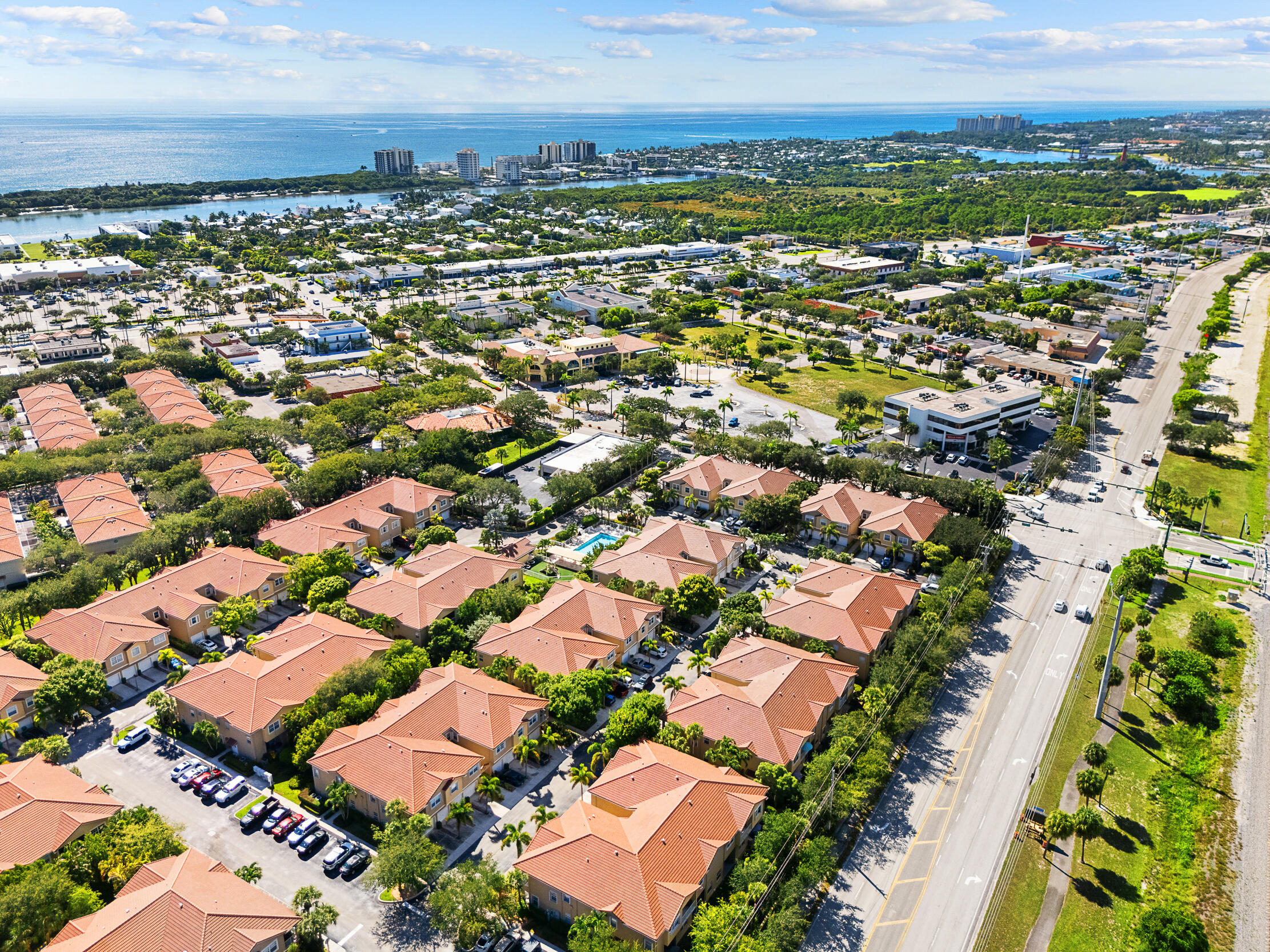 115 Lighthouse Circle, Unit C Tequesta, FL 33469 - Photo 2 of 29 an aerial view of residential houses with outdoor space