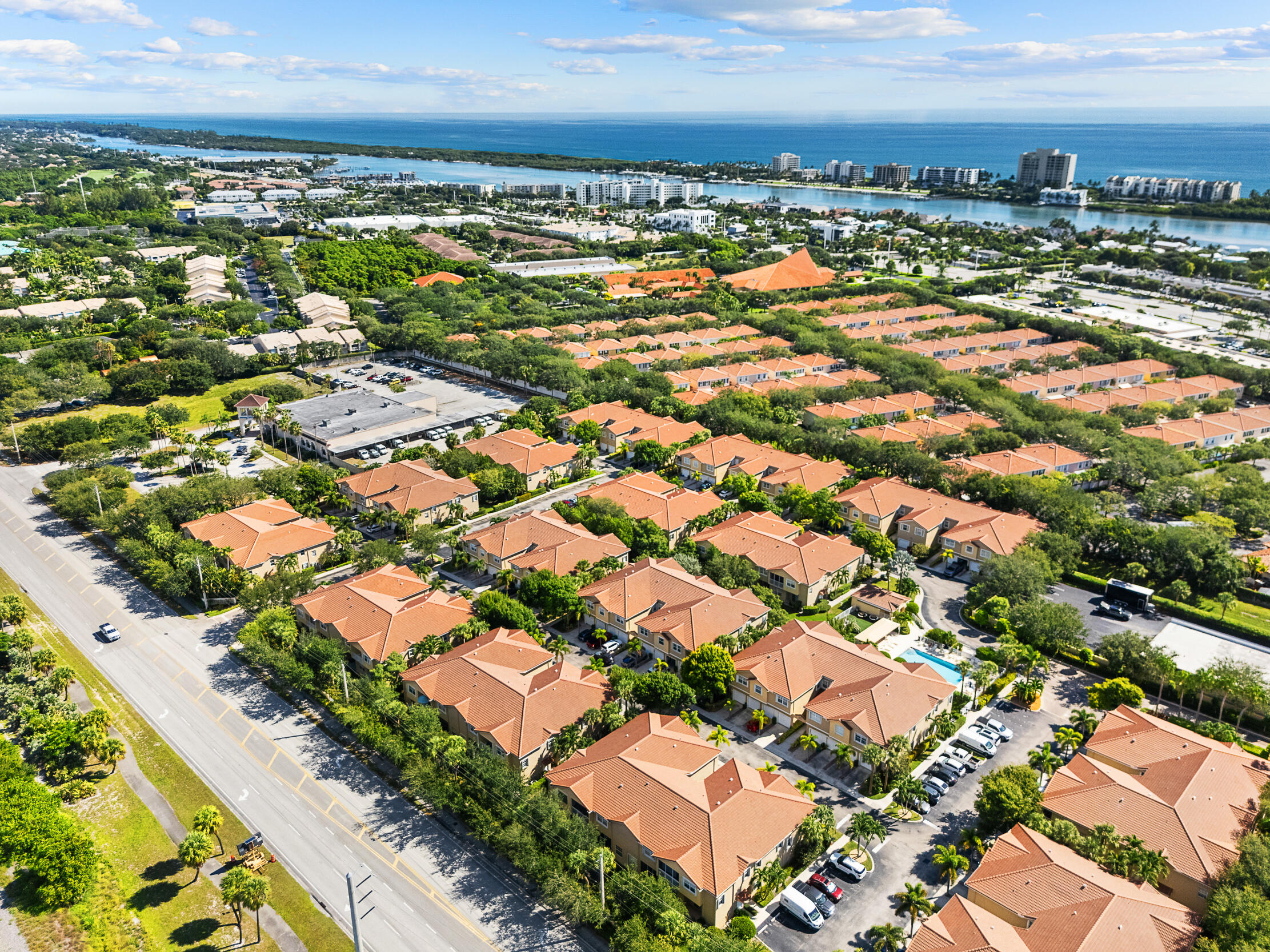 115 Lighthouse Circle, Unit C Tequesta, FL 33469 - Photo 23 of 29 an aerial view of residential building with parking space