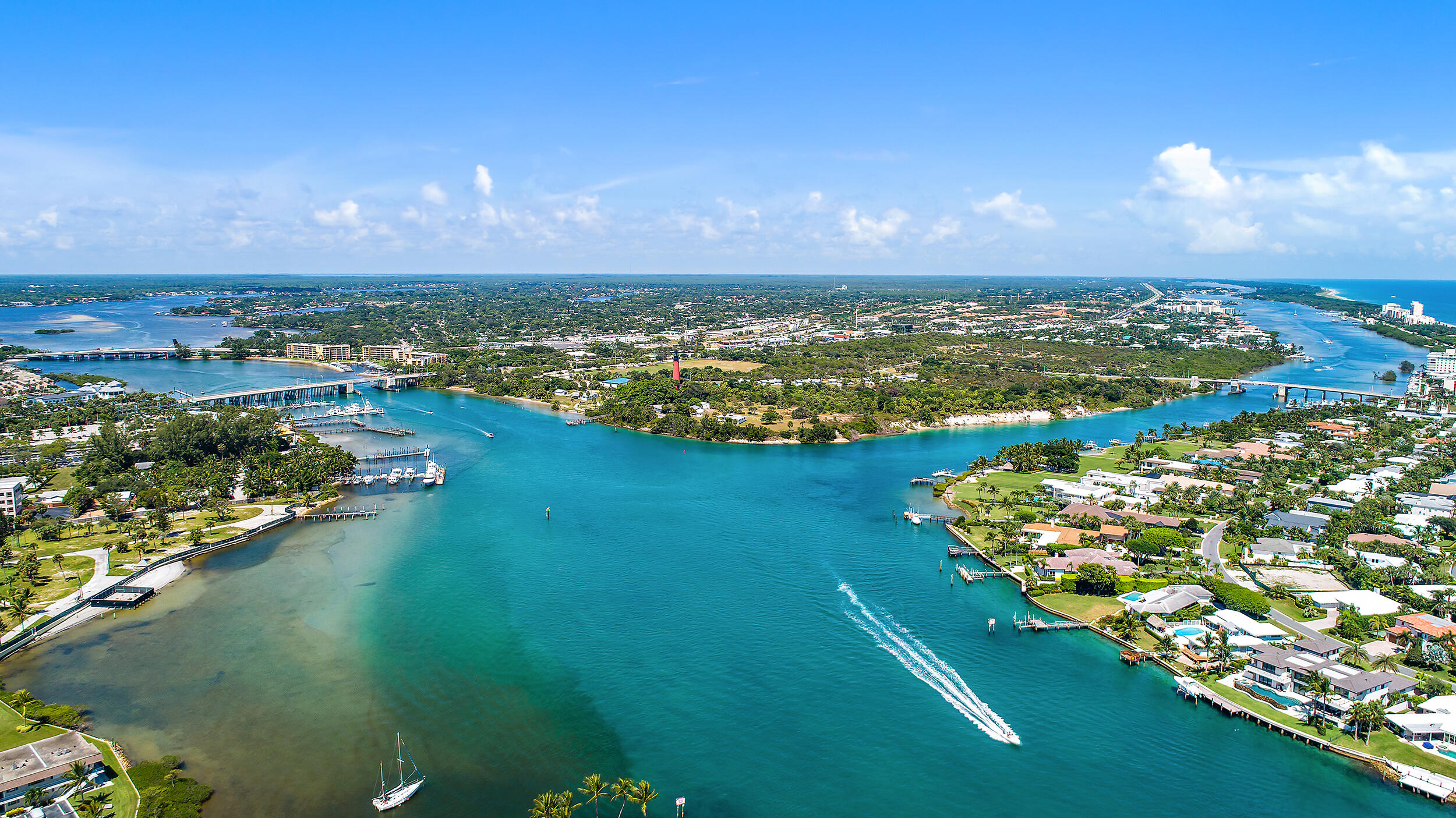 115 Lighthouse Circle, Unit C Tequesta, FL 33469 - Photo 25 of 29 a view of a lake with a city