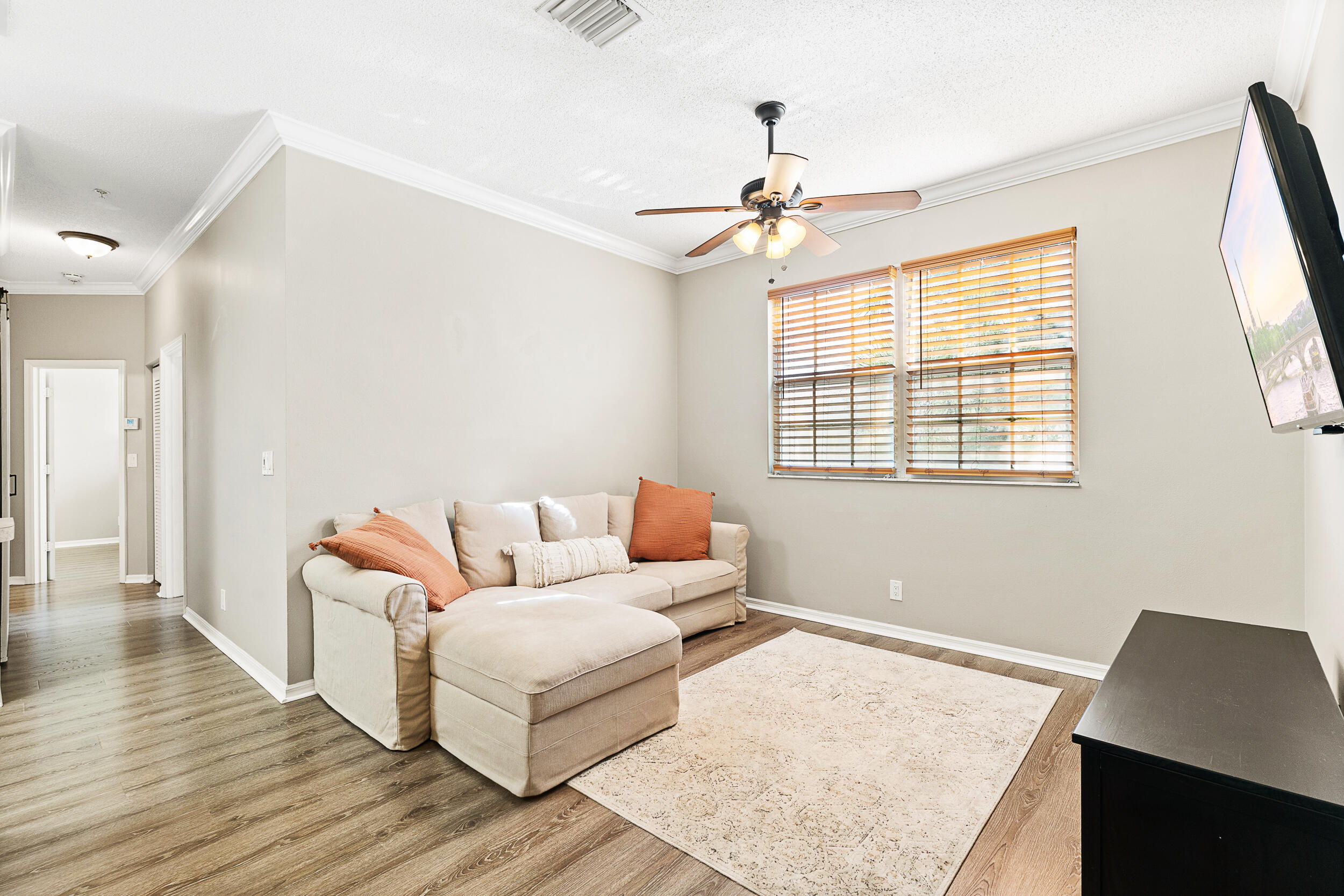 115 Lighthouse Circle, Unit C Tequesta, FL 33469 - Photo 7 of 29 a living room with furniture and a window