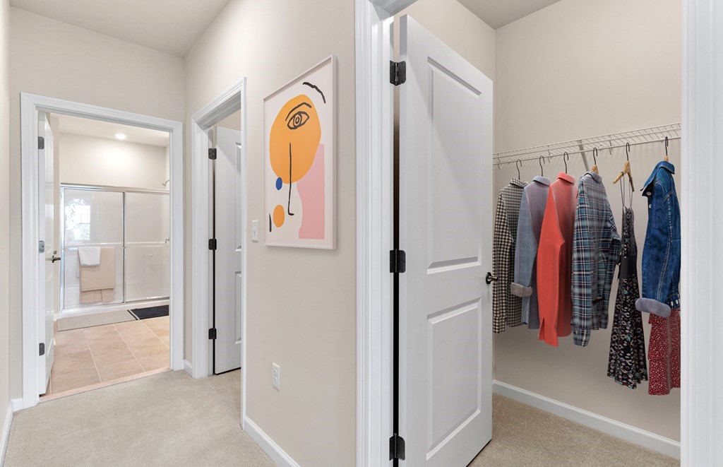 2 Stratton Drive, Unit 303 Woburn, MA 01801 - Photo 6 of 8 a view of walk in closet with clothes